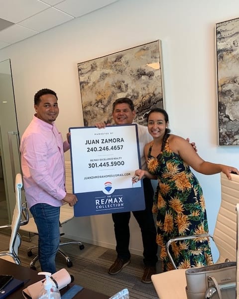 Closing day with the RE/MAX Collection — another family in their new home